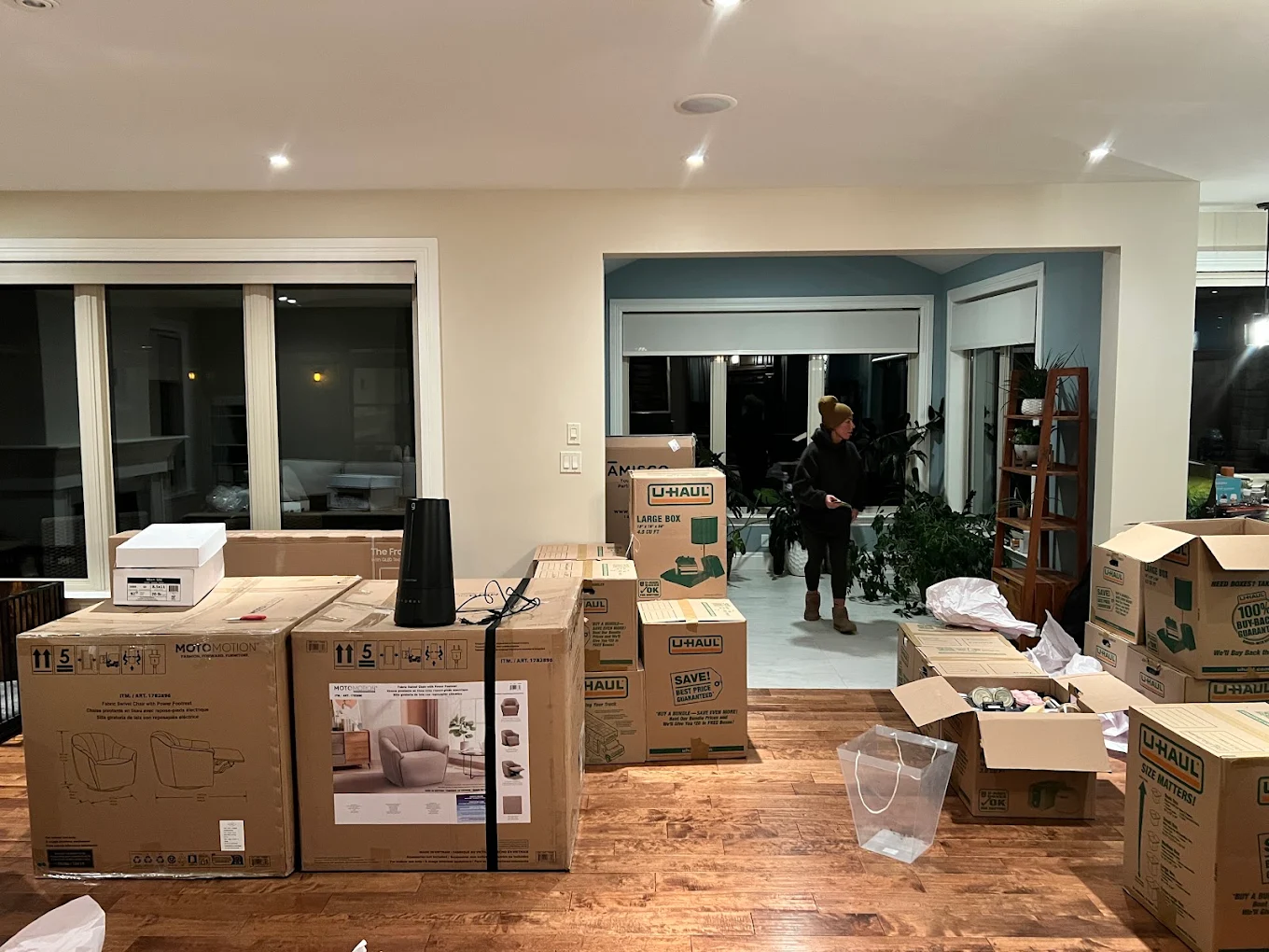 A living room filled with packed moving boxes ready to go